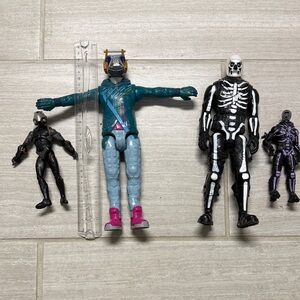 Assorted Action Figure Lot with Skeleton and Teal Astronaut